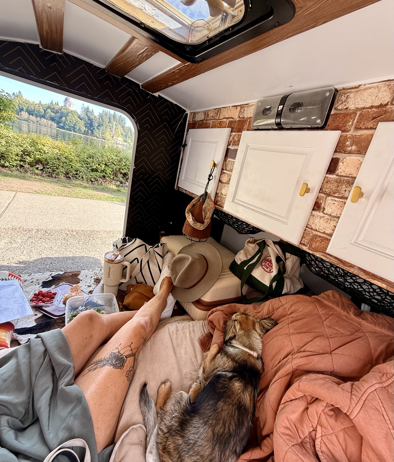 Kelly and Roo relaxing inside their teardrop camper